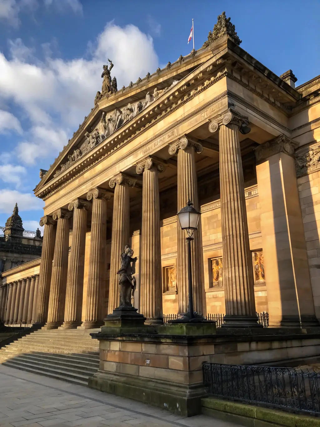 A detailed shot of the Scottish National Gallery, highlighting its neoclassical architecture and the vibrant cultural scene it represents.